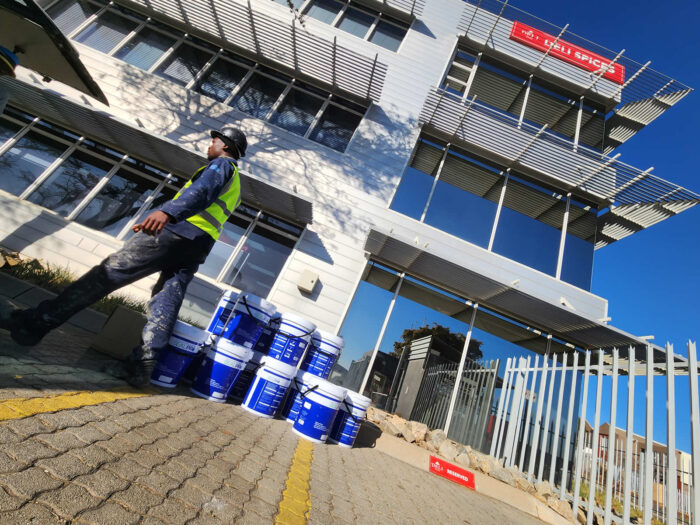 5.ExpertCoatings delivering product for the Deli Spice Factory Roof Renewal, Midrand 5.ExpertCoatings delivering product for the Deli Spice Factory Roof Renewal, Midrand